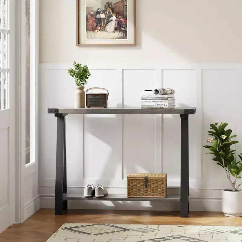 Slim double-tiered entryway table with storage shelves, durable metal frame, and V-shaped legs  suitable for living rooms, hallways, or foyer.